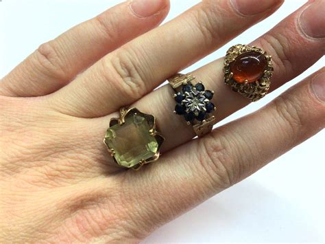 Lot 1030 Three 9ct Gold Gem Set Dress Rings