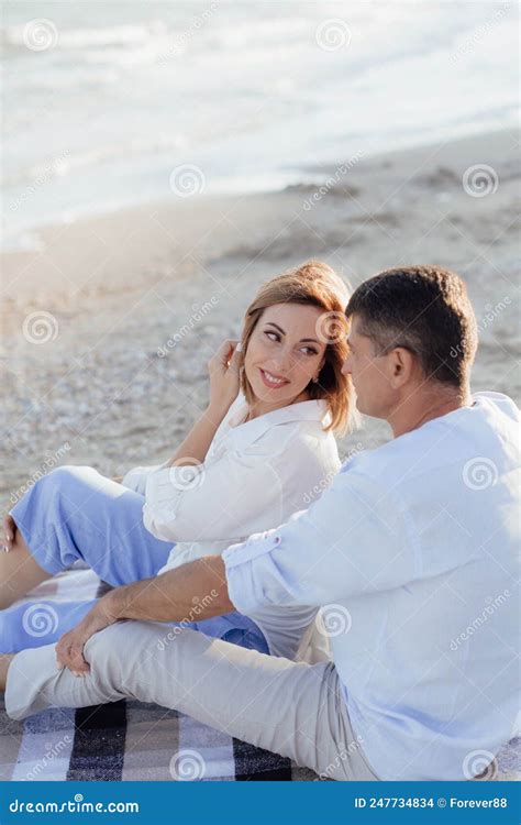 Happy Romantic Middle Aged Couple Enjoying Beautiful Sunset Walk On The