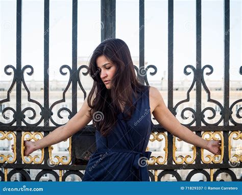 Beatiful Brunette Woman Crucified On A Palace S Gate Stock Image