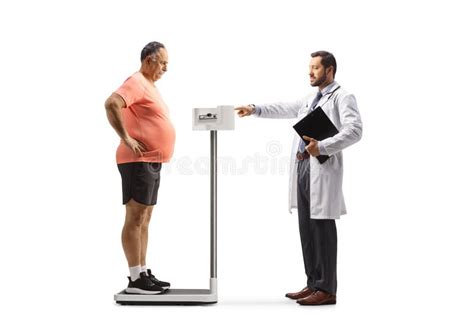 Doctor Measuring A Mature Patient In Sportswear On A Medical Weight