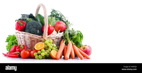 Fresh Organic Fruits And Vegetables In Wicker Basket Isolated On White