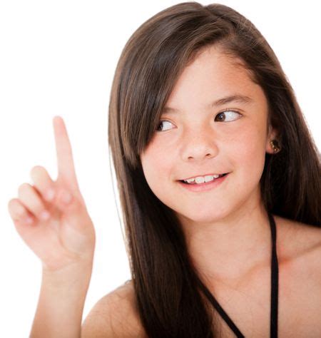 Girl Pointing Up With Her Finger Isolated Over A White Background