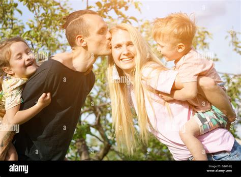 Portrait of a happy family outdoors Stock Photo - Alamy