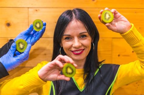 Premium Photo Portrait With Many Kiwis In The Hand Of A Brunette