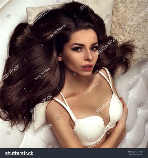 Стоковая фотография 365264657 Sexy Brunette Woman Lying On Bed