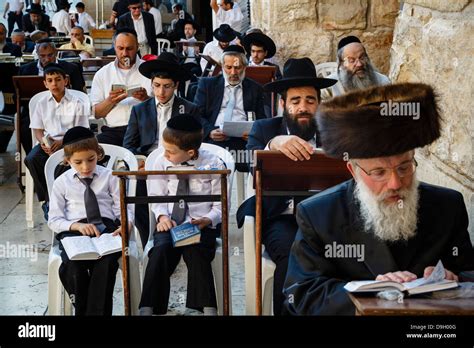 Orthodox Jewish People Praying At A Synagogue By The Western Wall Stock