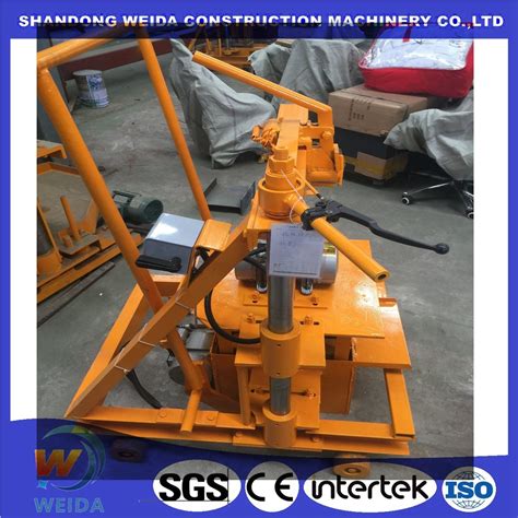 Qm Low Cost Small Simple Mobile Egg Laying Cement Brick Making