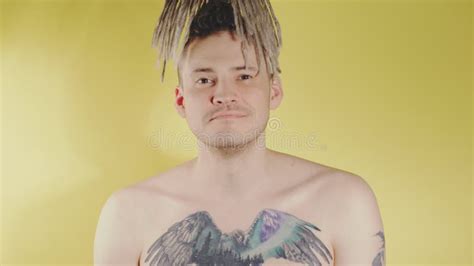 Naked Handsome Man With Tattoo On Chest Nodding Head With Approval