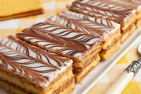 Mille-feuille is a three layers of French pastry dipped in vanilla cream.