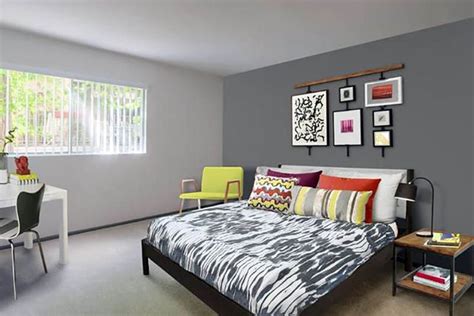 Bedroom With Light Gray Paint And Dark Gray Accent Wall Behind Bed