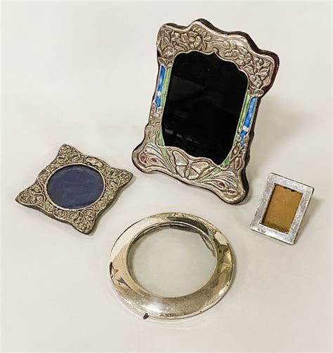 FOUR SILVER FRAMES Southgate Auction Rooms