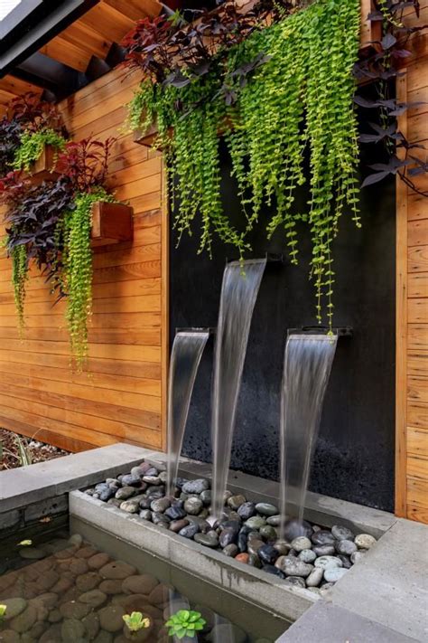 Lush Grasses And Purple Blooms Create A Sculptural Garden Waterfalls