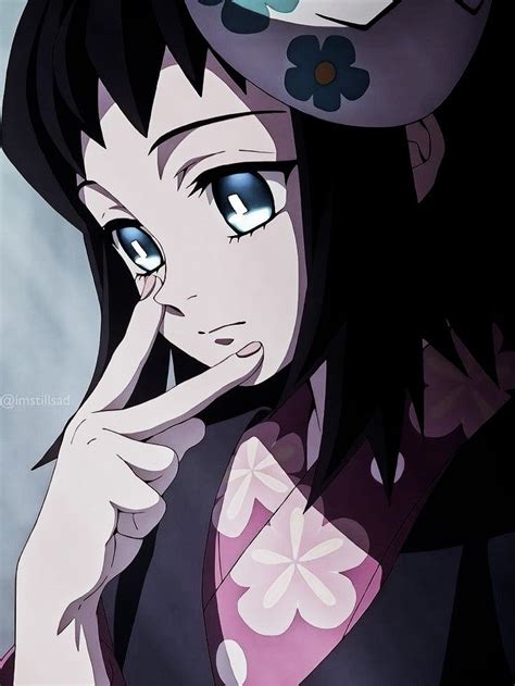 An Anime Character With Blue Eyes Holding Her Hand Up To Her Face And