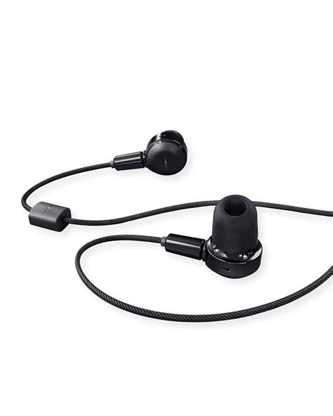 the earphones are connected to each other on a white surface with black ...