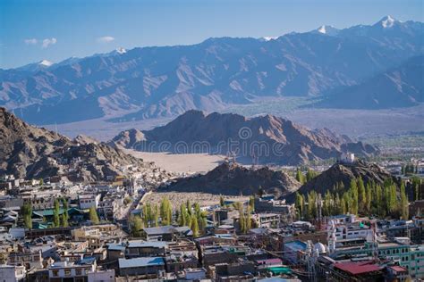 Leh Town Seen From Above With Many Houses And Mountains Surrounded At