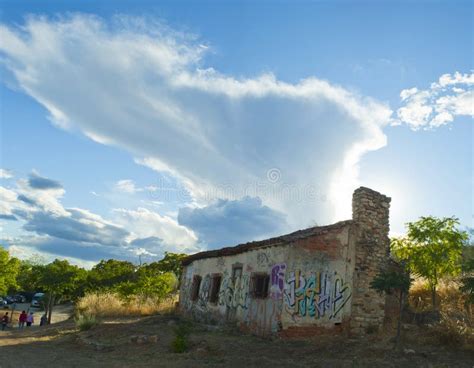 graffiti   abandoned house   storm cumulonimbus  stock