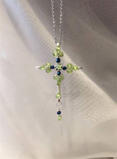 This Gorgeous Peridot Cross Pendant Is Adorned With 15 Genuine Faceted