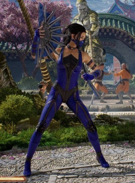 A Woman In Blue And Black Outfit Holding Two Swords