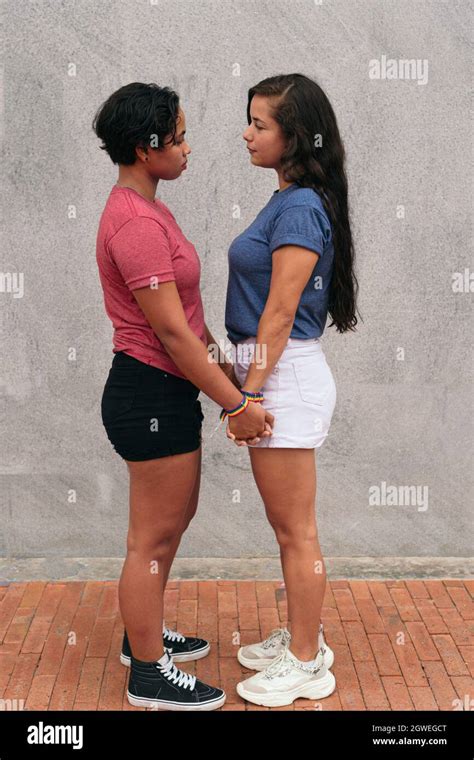 Latina Lesbian Couple Stare At Each Other During A Date In The City Stock Photo Alamy