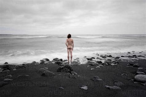Lanzarote Rear View Of Nude Man Standing On Playa De Janubio Stock Photo
