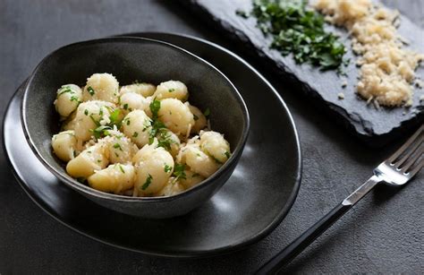 Premium Photo Traditional Homemade Cooked Italian Potato Gnocchi With Butter Parsley And