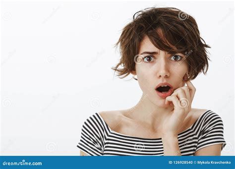 Portrait Of Shocked And Worried Cute Female With Short Stylish Haircut