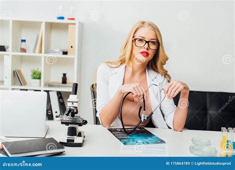 Beautiful And Nurse In Glasses Holding Stock Image Image Of Medical Press 175864789