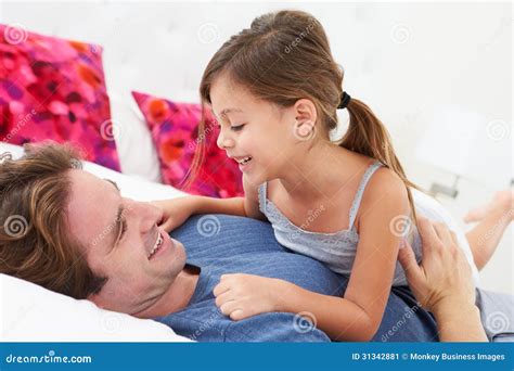 Father And Daughter Lying In Bed Together Stock Image Image Of