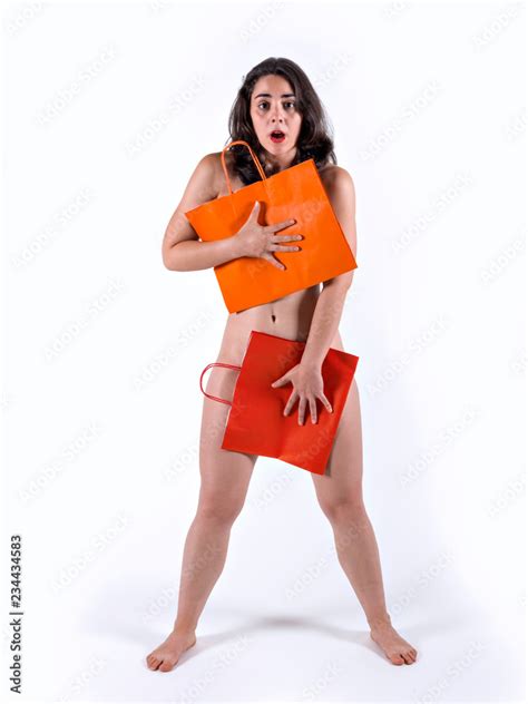 Naked Woman Covering Herself With Recycled Paper Bags ภาพถ่ายสต็อก