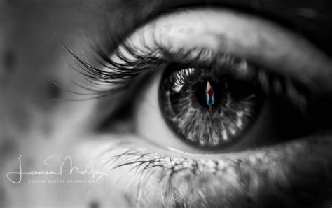 An Eye With A Red And Blue Stripe On Its Iris Looking Into The Camera