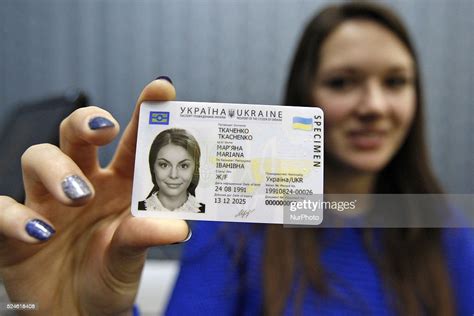 An Ukrainian Girl Holds In Her Hand A Specimen Of New Id Passport Of