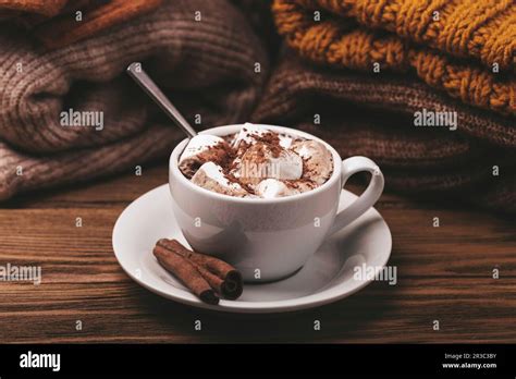 Hot Chocolate With Marshmallow And Pile Of Warm Knitted Clothes Stock Photo Alamy