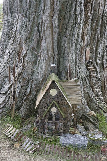 A Small House Built Into The Side Of A Tree