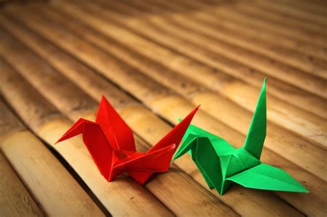 Premium Photo High Angle View Of Paper Cranes On Wooden Plank