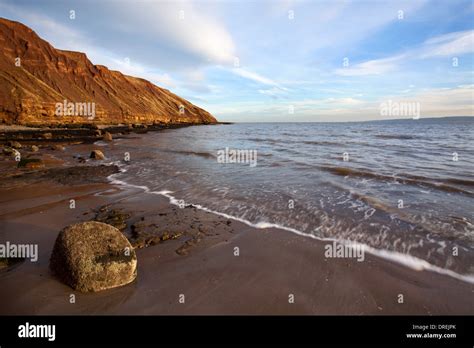 Rock On The Beach And Filey Brigg Filey North Yorkshire England Stock