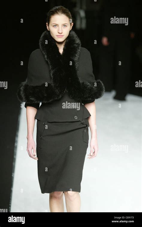 Hussein Chalayan Paris Ready To Wear Autumn Winter Model Brunette Hair Off Face Wearing Dark