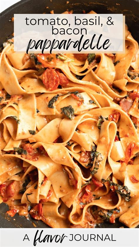 A Skillet Filled With Pasta And Sauce On Top Of A White Tablecloth That