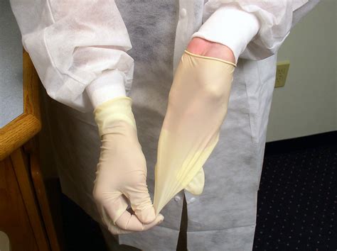 Safety Gloves | Free Stock Photo | A lab technician pulling off ...