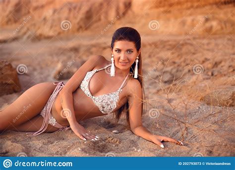 Slim Woman Enjoying Beautiful Sunset On The Beach Fashion Outdoor Photo Of Sensual Bikini Model