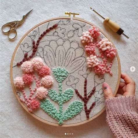 Someone Is Working On An Embroidery Project With Flowers And Leaves In