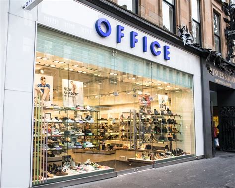 Exterior Of Office Footwear Shoe Shop Showing Logo Signage And