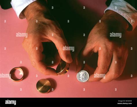 Magicians Hands Performing Coin Tricks Sleight Of Hand Stock Photo Alamy