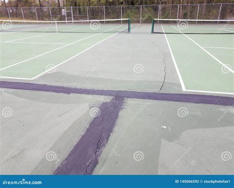 Black Tar To Repair Cracks On Green Tennis Court Stock Photo Image Of