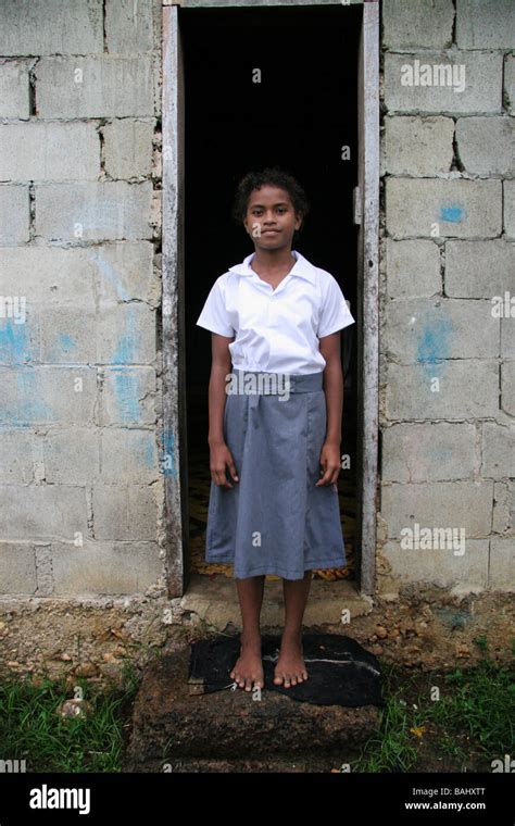 Young girl outside village home in school uniform Stock Photo - Alamy