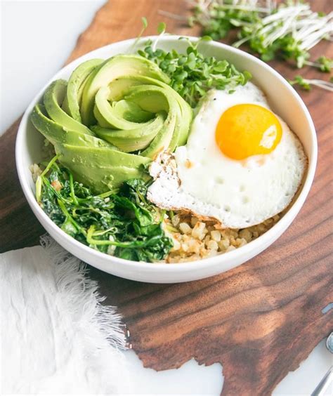 Breakfast Buddha Bowl With Avocado Cauliflower And Egg Recipe Breakfast Bowls Vegetarian