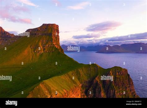 Kallur Lighthouse On Green Hills Of Kalsoy Island Faroe Islands