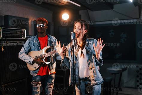 Guy Plays Guitar Girl Sings African American Man With White Girl