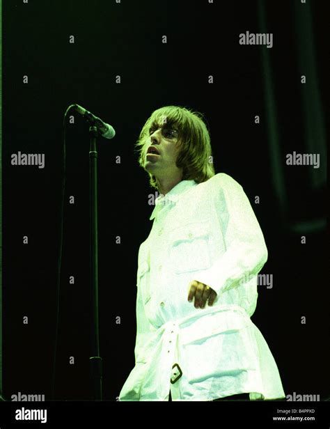 Liam Gallagher of Oasis singing at their Knebworth concert Stock Photo ...