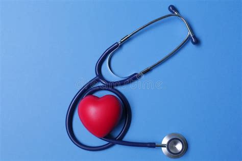 Red Heart Shape And Stethoscope On Blue Background Stock Photo Image