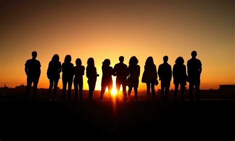 Group of people silhouette in the sunset 28710529 Stock Photo at Vecteezy